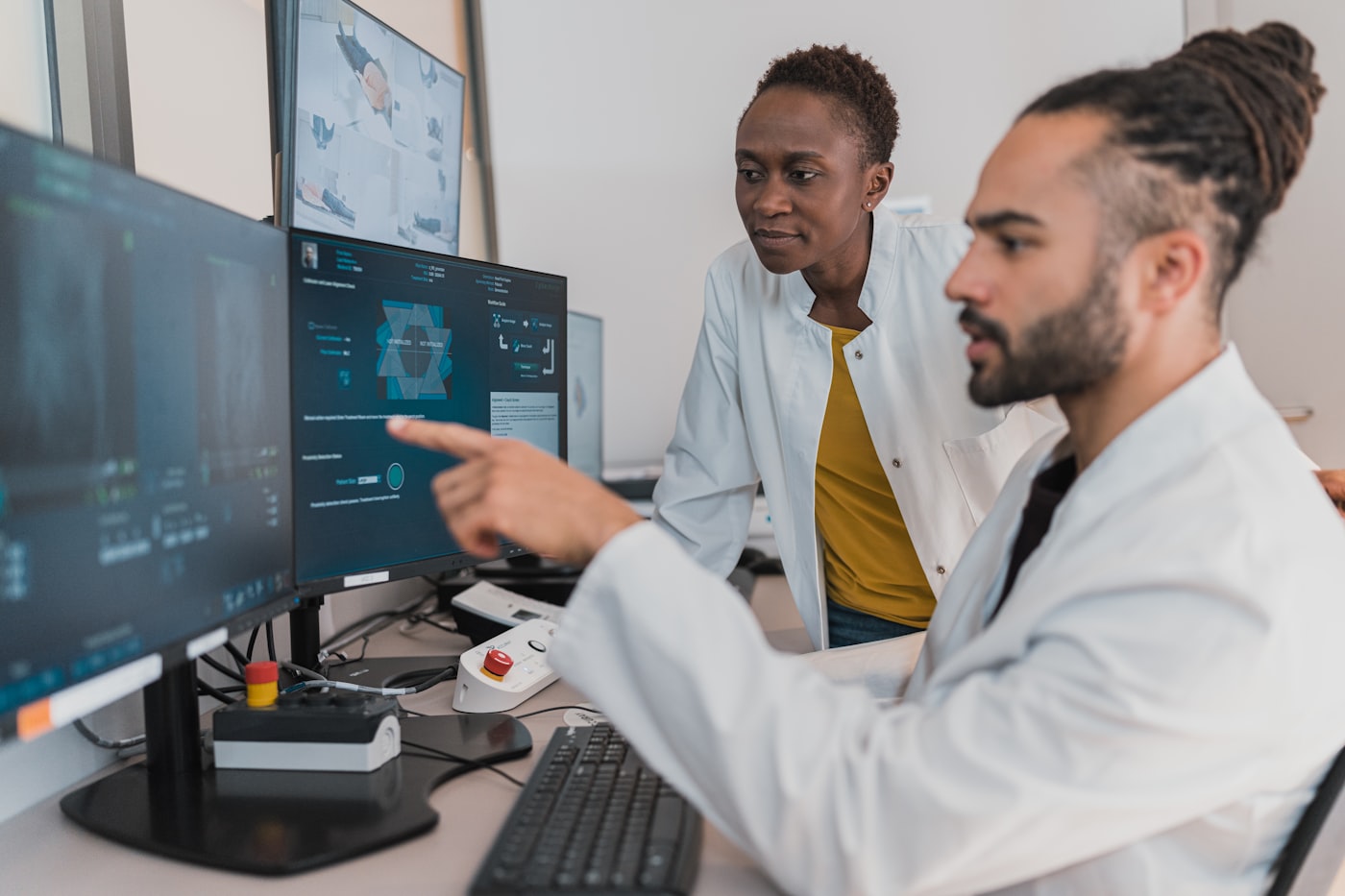 Clinical team reviewing patient data on connected monitors during an EHR and FHIR integration project