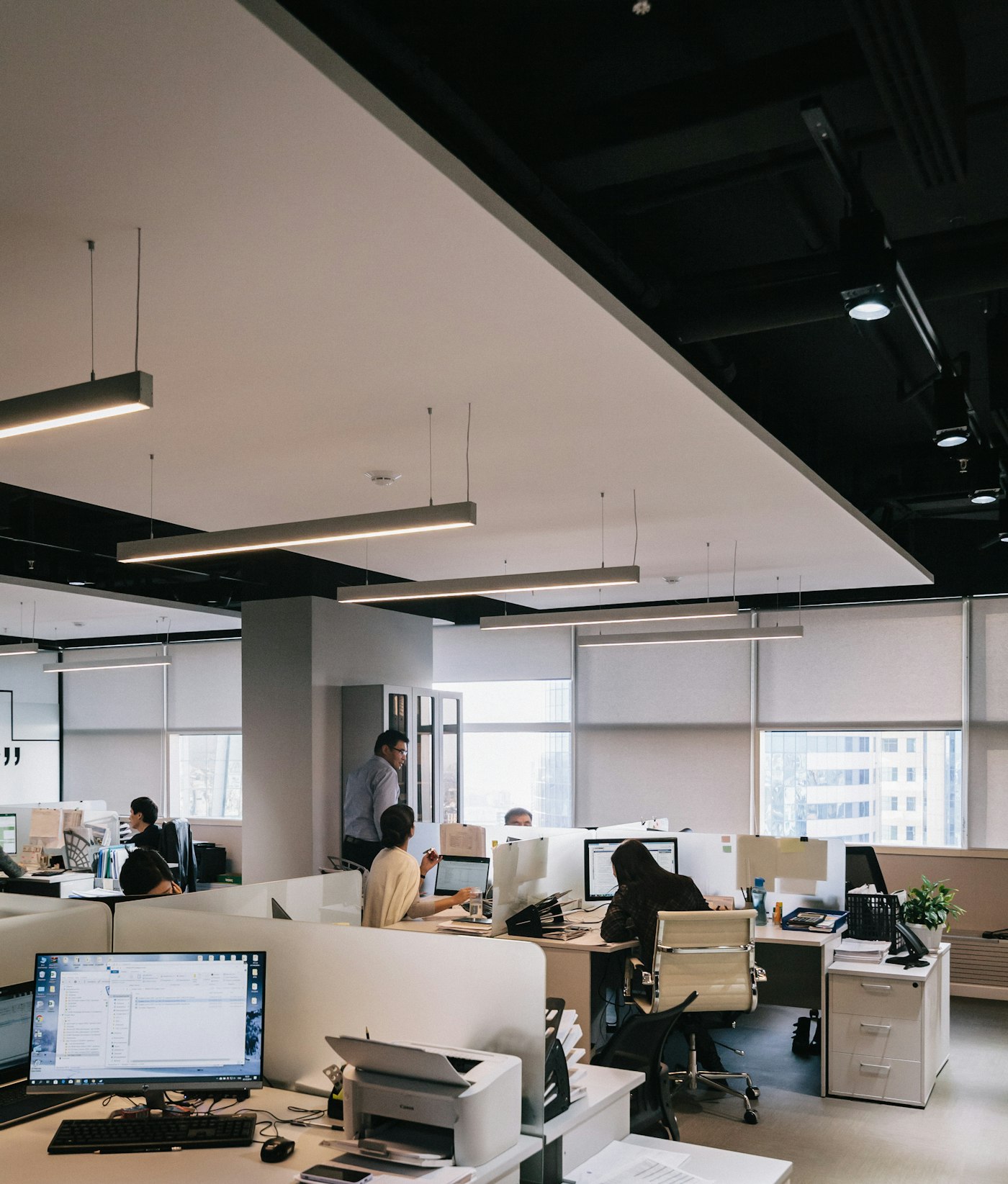 software engineers in a nearshore development office reviewing architecture diagrams