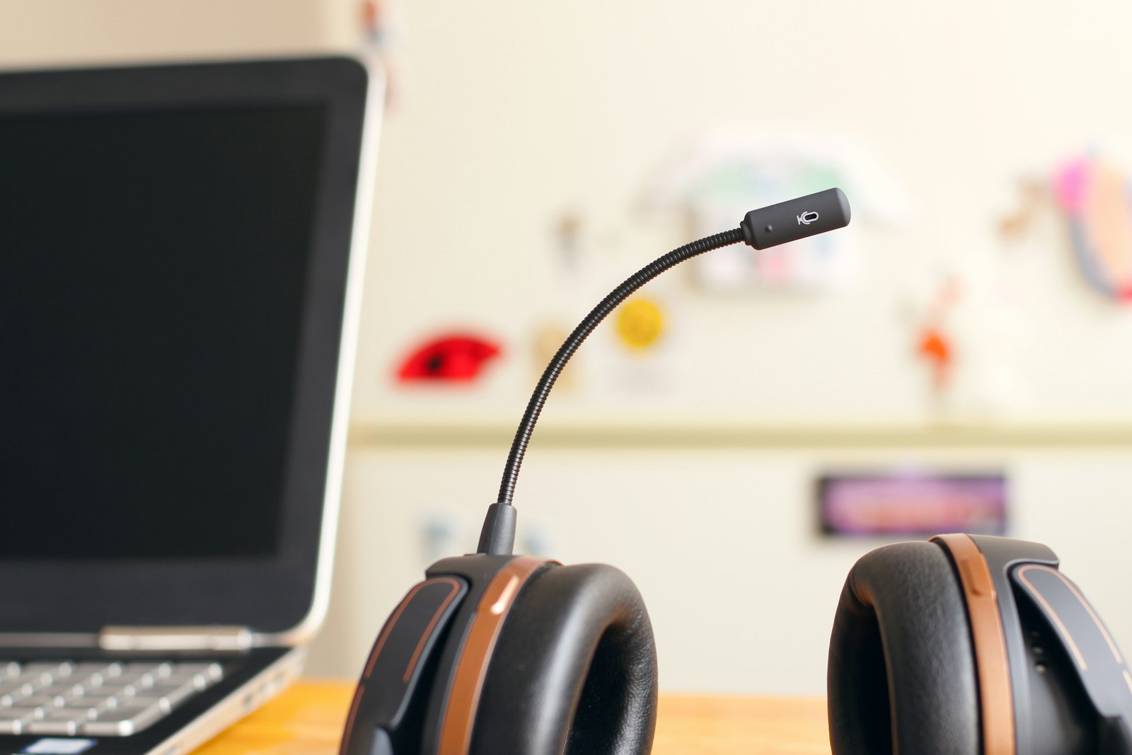 AI chatbot development cost in 2026 — a support headset beside a laptop on a desk