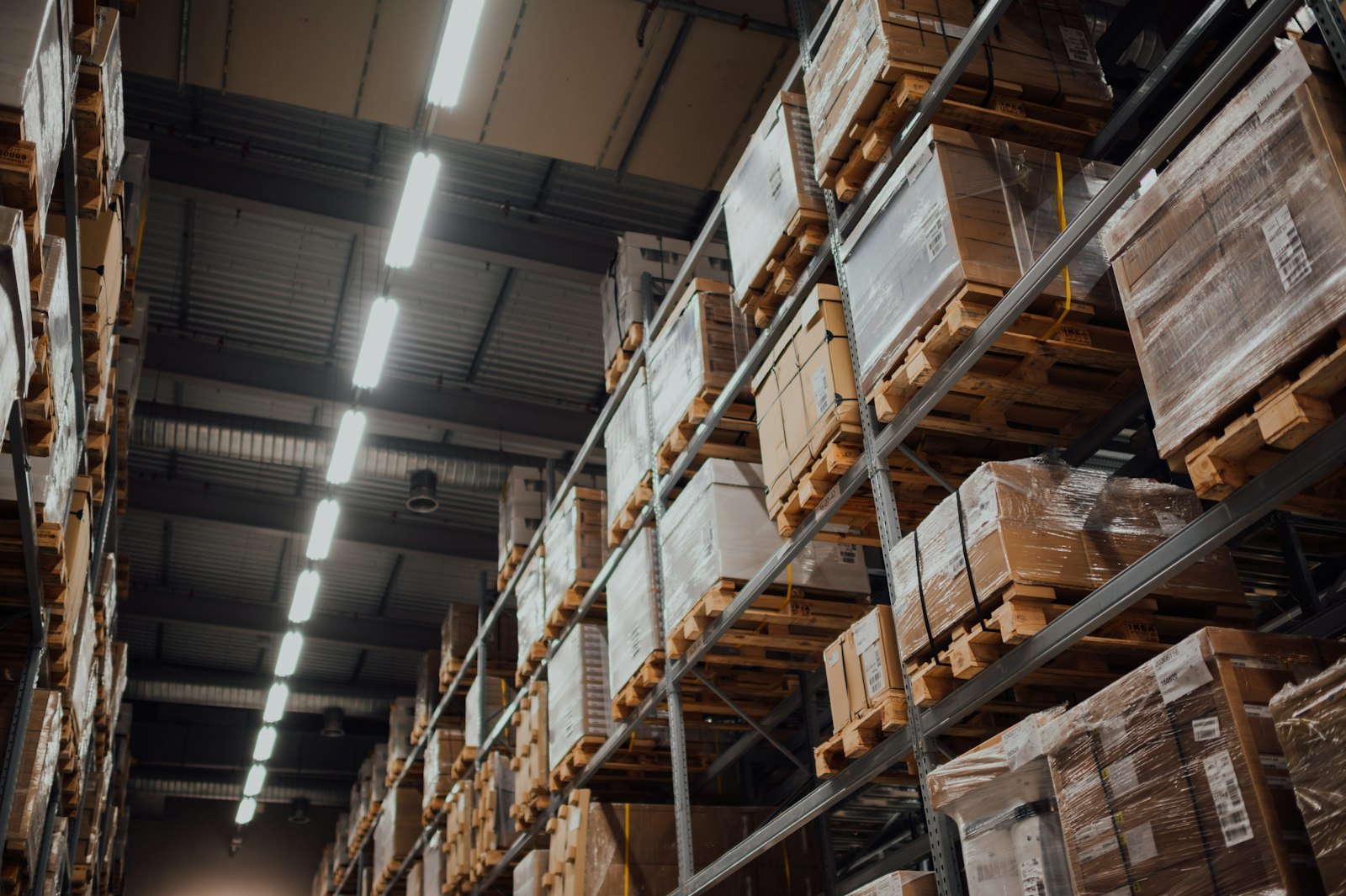 Ecommerce fulfilment warehouse with racks of shipped orders — inventory location can create physical nexus and affect tax sourcing