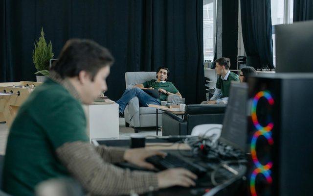 Collaborative engineering team working together in an open office